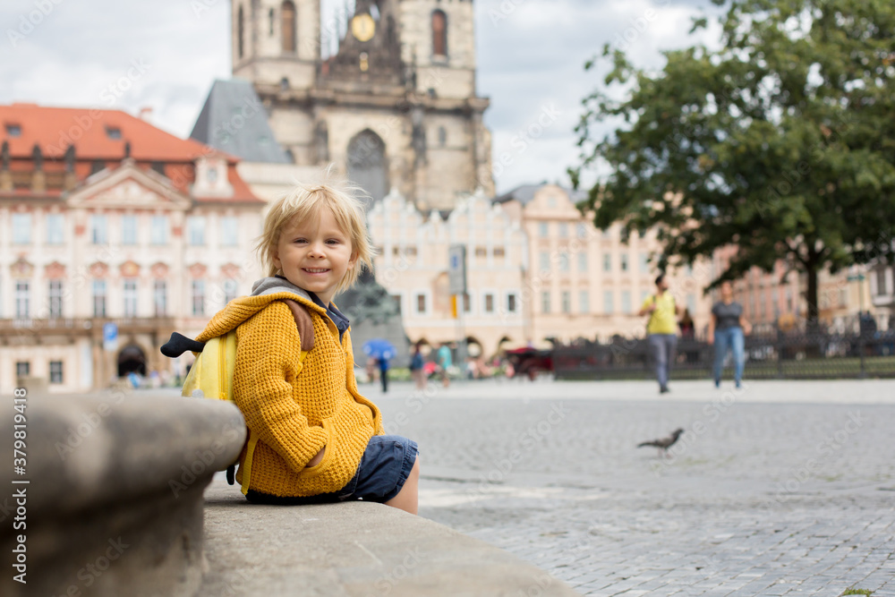 Obraz premium Cute child, boy, visiting Prague after the quarantine Covid 19