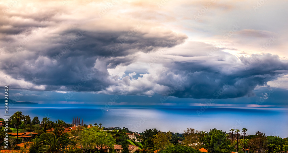 Obraz premium Massive Storm Clouds Over Blue Ocean