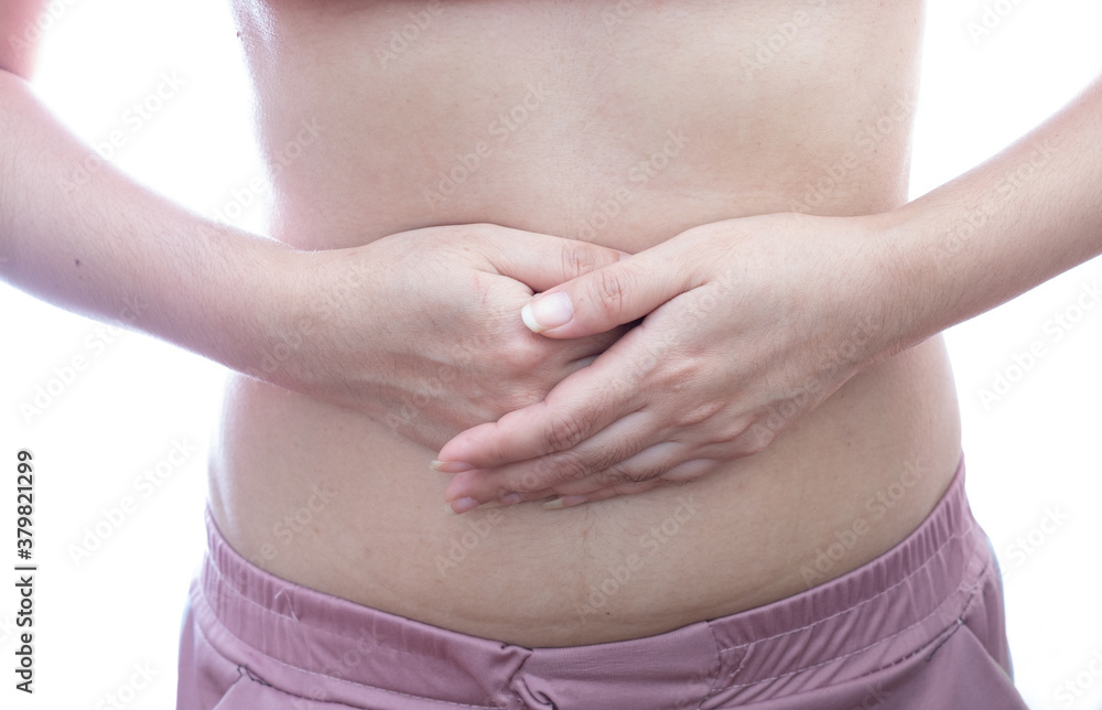 Young woman with abdominal pain at white background Young woman with abdominal pain at white background