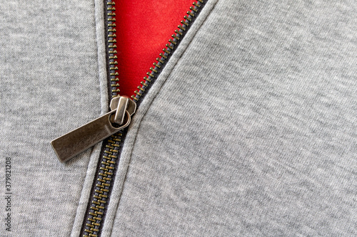 Metal zipper on the sports jacket. Close up. Selective focus.