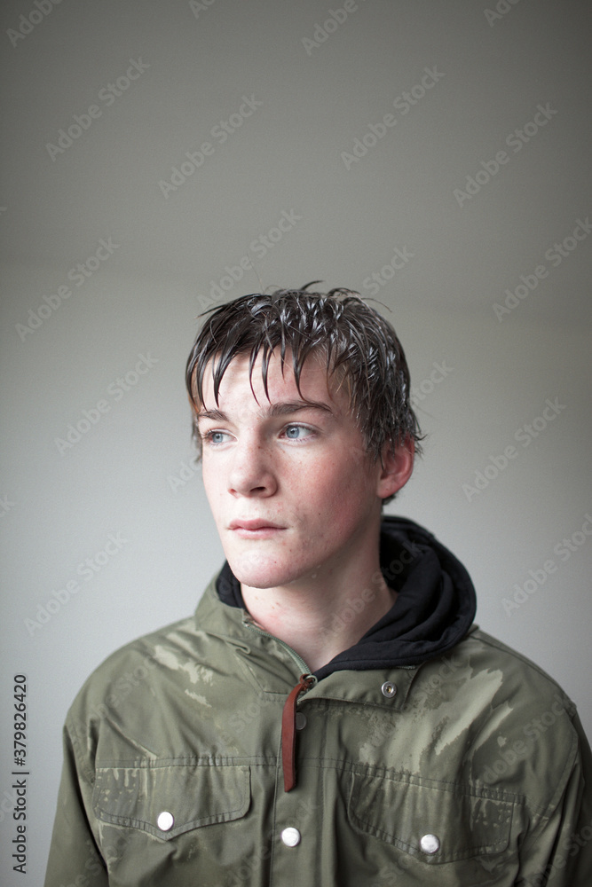 Portrait of a teenage boy wet from the rain Portrait of a teenage boy wet from the rain