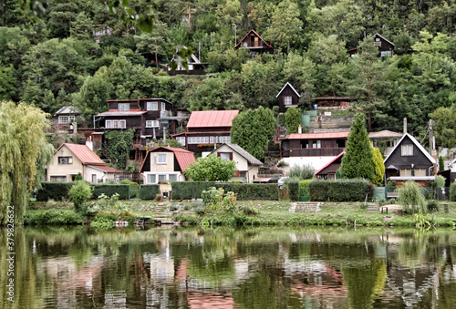 Wooden cottage settlement by the Berounka river