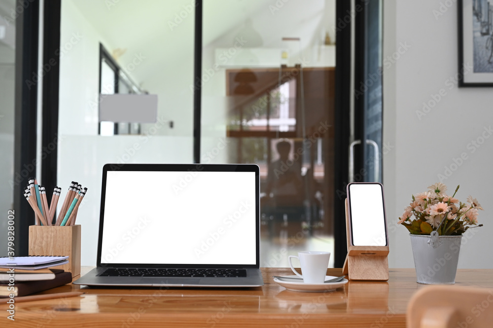 Office desk with laptop, smartphone white isolated screen and office supplies. Office desk with laptop, smartphone white isolated screen and office supplies.