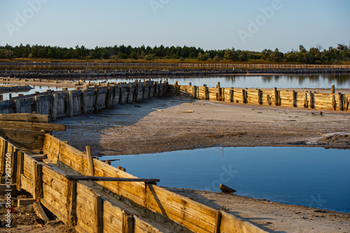 Salt evaporation lake shores. An industrial salt plant produces - natural sea salt.