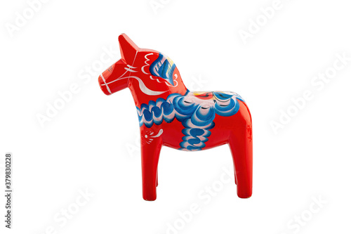 A Traditional Dalecarlian horse isolated on a white background.