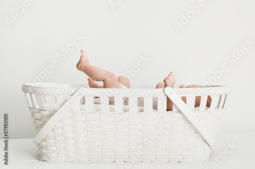 flailing baby in a basket photo