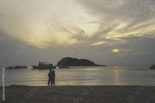couple walking by the beach
