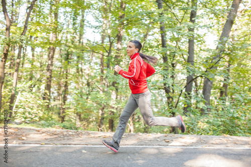 Woman Jogging in the Forest photo