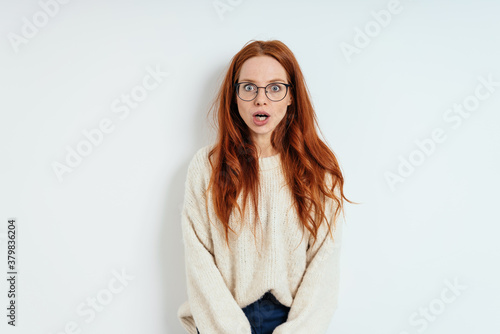 Shocked young woman with her mouth agape