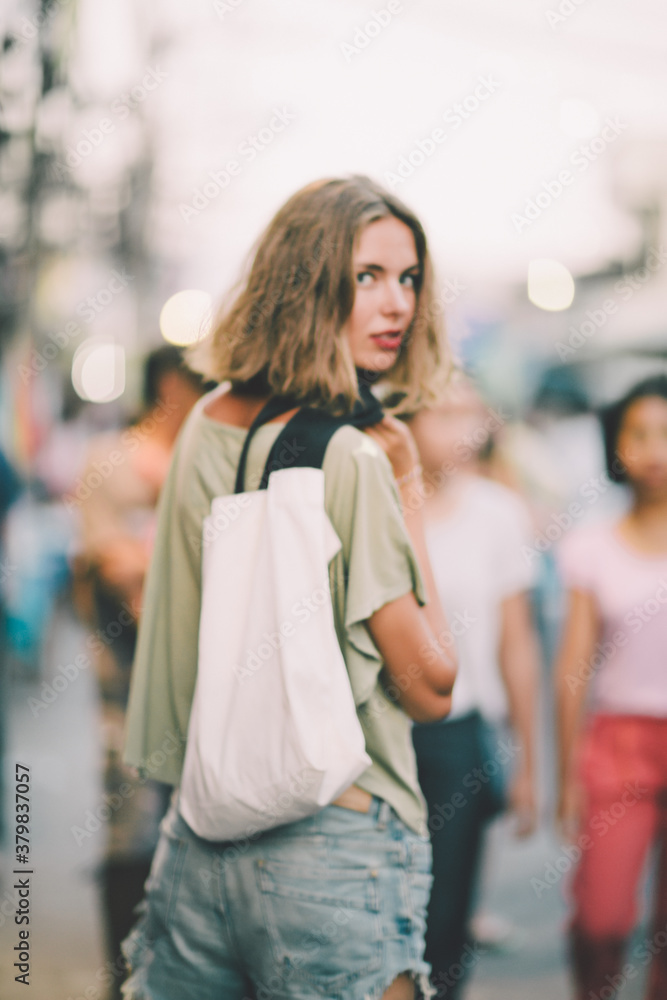Beautiful young woman walking on the street in Thailand Beautiful young woman walking on the street in Thailand
