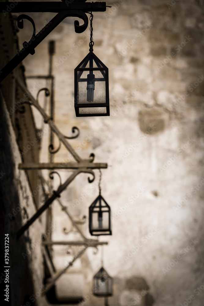 Hanging street lanterns in a black and white filter