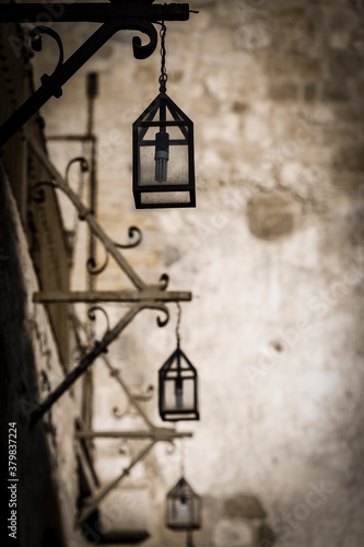 Hanging street lanterns in a black and white filter