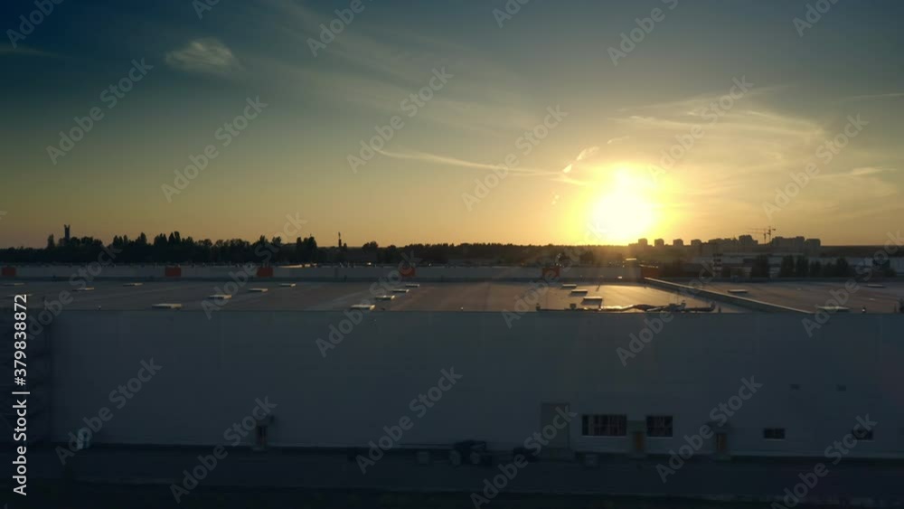 Modern storage facility building in big city suburb at sunset logistics business Modern storage facility building in big city suburb at sunset logistics business