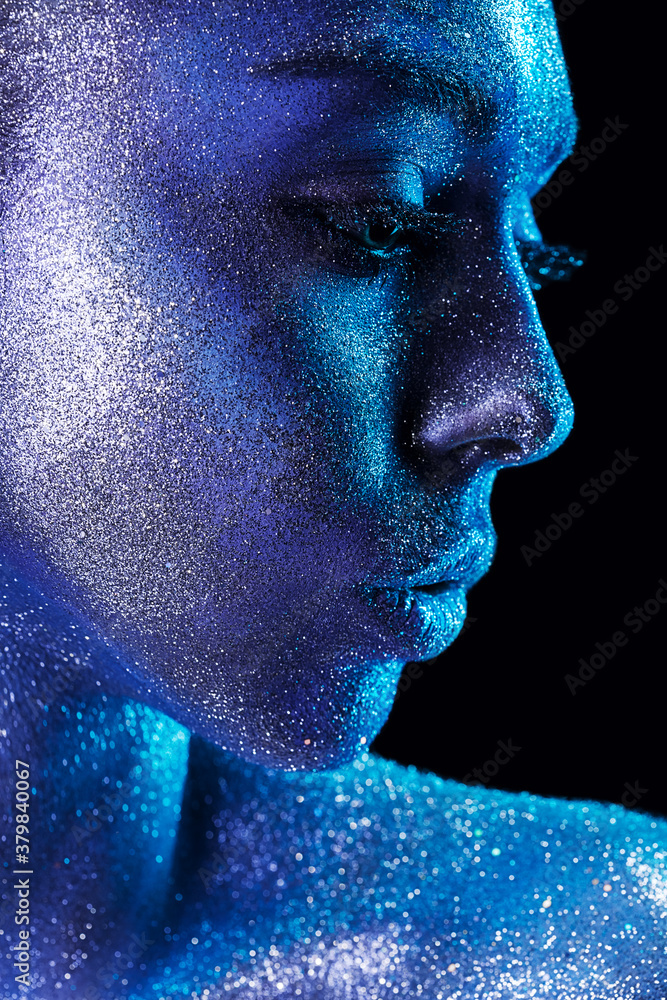 magic cute woman with blue body art with glitters magic cute woman with blue body art with glitters
