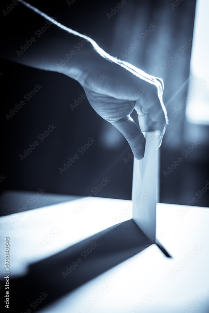Fototapeta premium Conceptual image of a person voting during elections