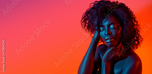 On fire. Beautiful face of young woman with clean and fresh skin. Flyer with copyspace for ad. Concept of beauty, healthcare, cosmetics, fashion. Attractive african woman with well-kept skin.