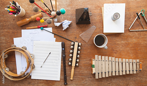 Overhead view of a music teacher's desk with random instruments photo