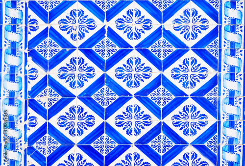 Detail of the traditional tiles from facade of old house. Decorative tiles.Portuguese traditional tiles. Floral ornament.