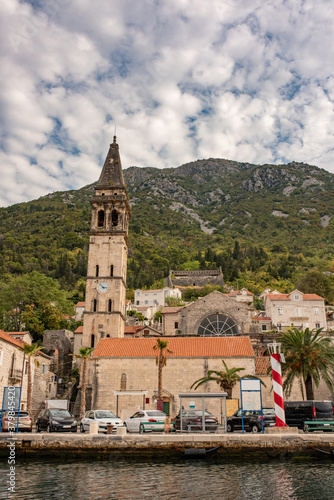Perast historic town at Kotor bay. Ancient city in Montenegro. Chapel with a bell tower in center of Perast.