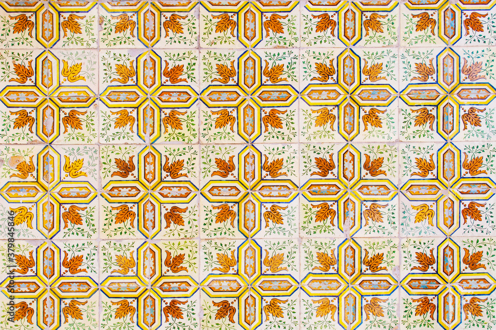 Detail of the traditional tiles from facade of old house. Decorative tiles.Portuguese traditional tiles. Floral ornament. Detail of the traditional tiles from facade of old house. Decorative tiles.Portuguese traditional tiles. Floral ornament.