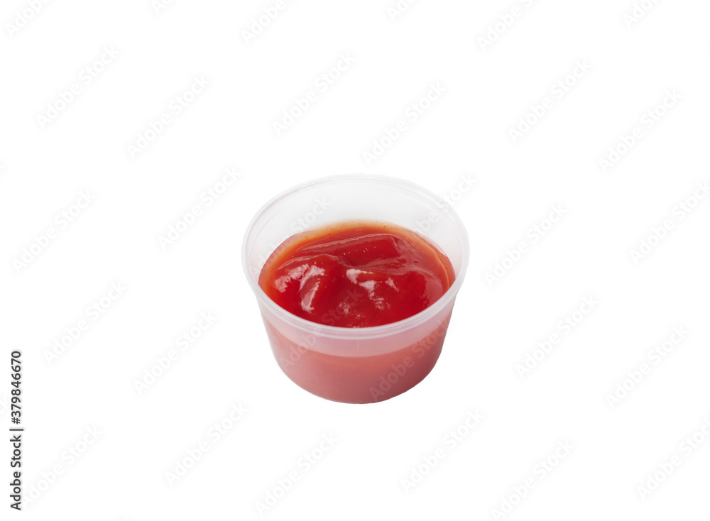 tomato sauce in a plastic container on an isolated white background tomato sauce in a plastic container on an isolated white background