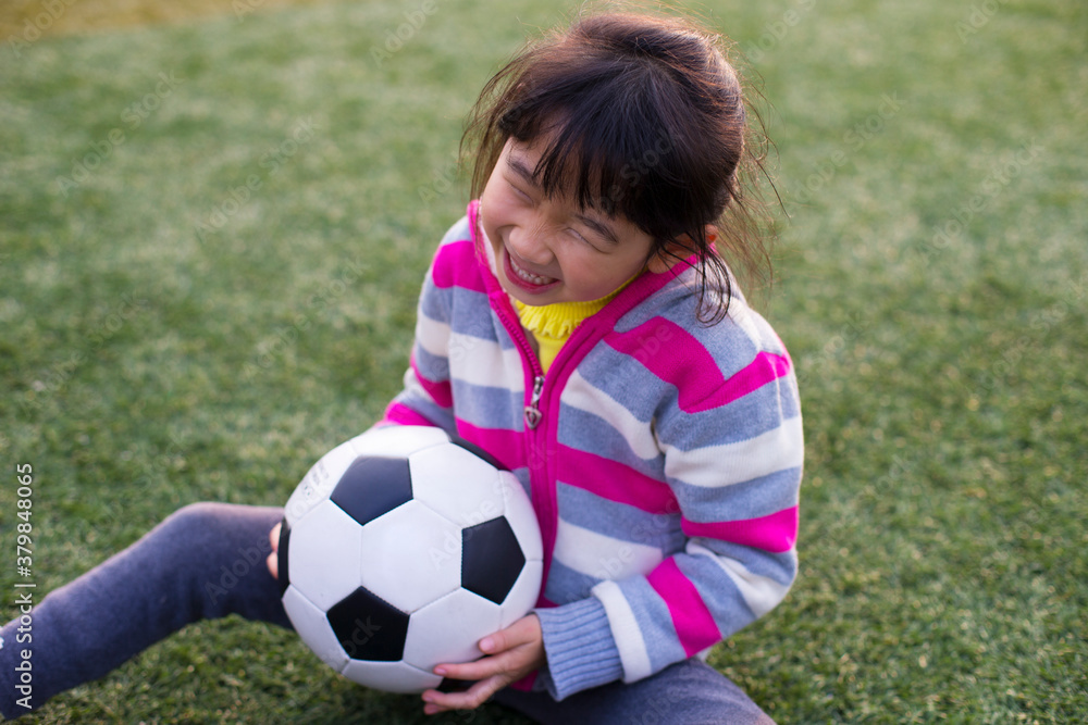 One Happy Little Girl in football field One Happy Little Girl in football field