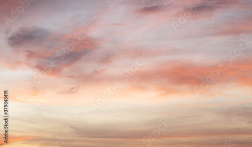 Sunset background sky with soft and blur pastel colour in pink and orange tone