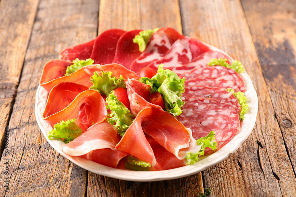assorted of meat slices- salami, bacon, ham