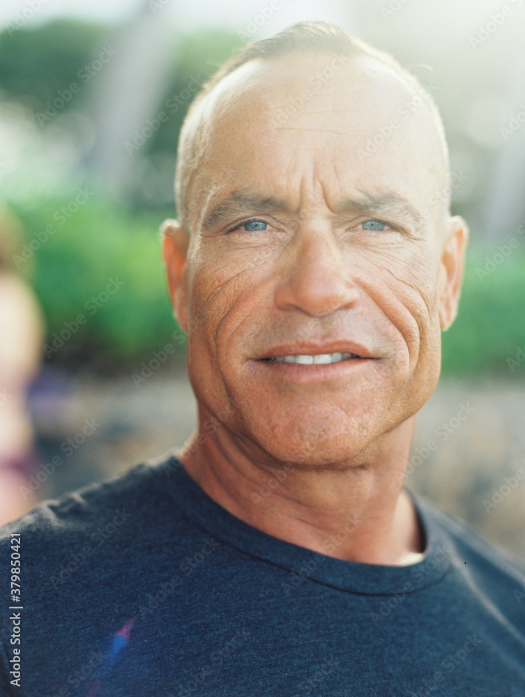 handsome ripped athletic senior man with surfboard at ocean handsome ripped athletic senior man with surfboard at ocean