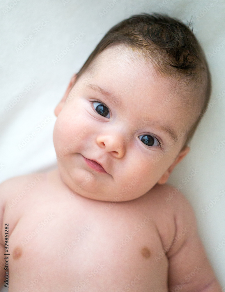 Caucasian baby boy looking at camera Caucasian baby boy looking at camera