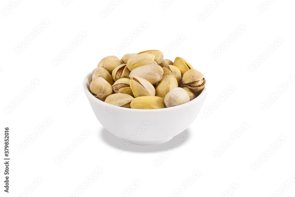 Pistachios in white porcelain bowl. Close-up. Isolated on white background. Pistachios in white porcelain bowl. Close-up. Isolated on white background.