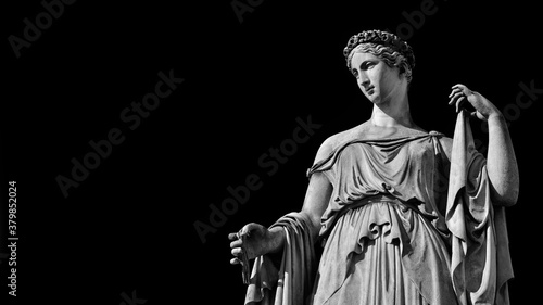 Paganism in Ancient Times. Roman or Greek goddess neoclassical marble statue, erected in the 19th century in Rome historic center (Black and White with copy space) photo