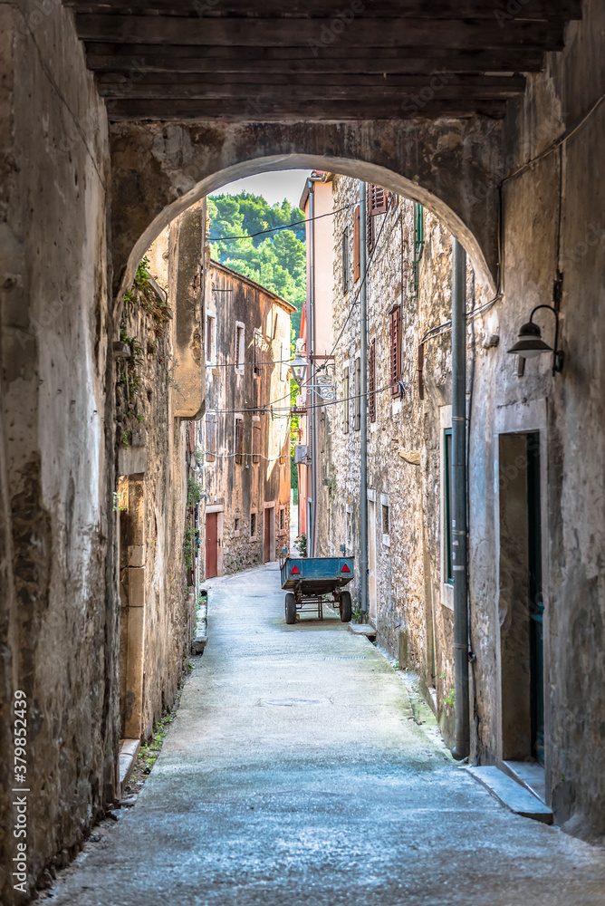 Fototapeta premium Narrow medieval street in the town of Skradin, Croatia