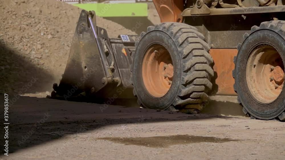 Bulldozer pushing gravel on a construction site Bulldozer pushing gravel on a construction site