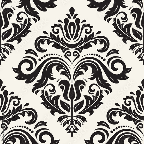 Classic seamless pattern. Damask orient light beigeand black ornament. Classic vintage background. Orient ornament for fabric, wallpaper and packaging