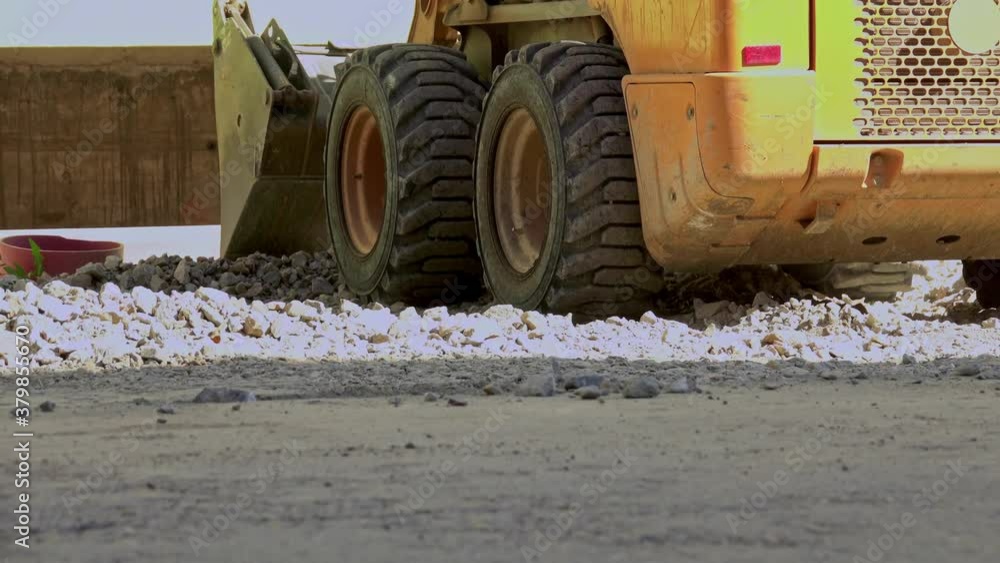 Bulldozer pushing gravel on a construction site Bulldozer pushing gravel on a construction site