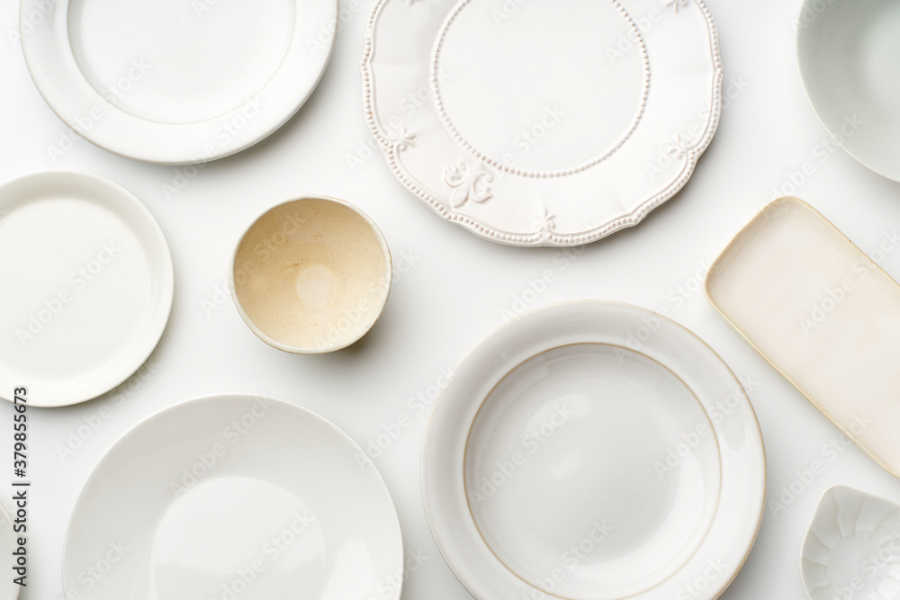 Top view of empty plates on white background Top view of empty plates on white background