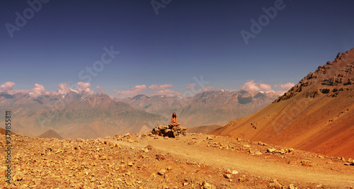 naked wild man meditating in mountains