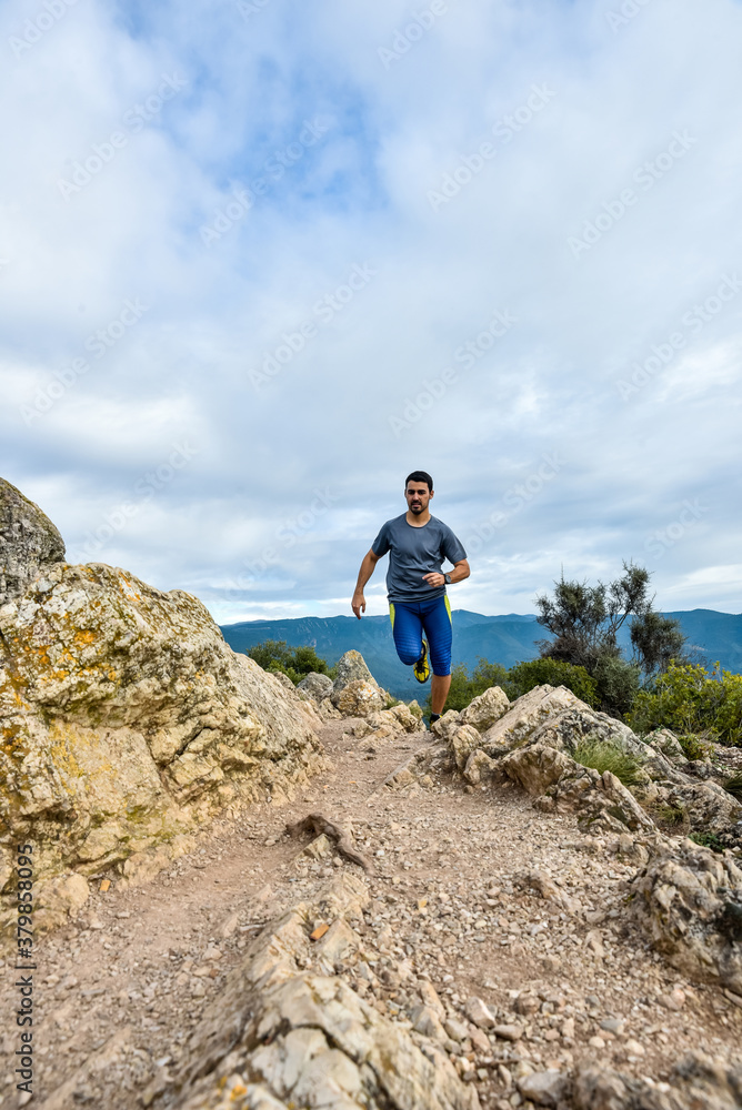 Sportsman running up the hill Sportsman running up the hill