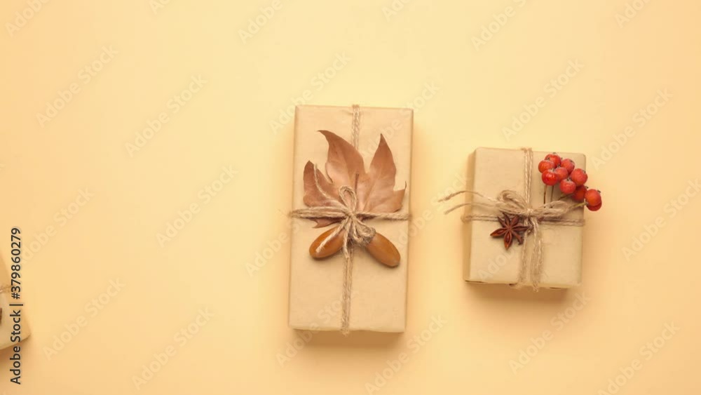 Autumn gifts moves on beige background - Stop motion animation of autumnal shopping sale. Black friday Autumn gifts moves on beige background - Stop motion animation of autumnal shopping sale. Black friday