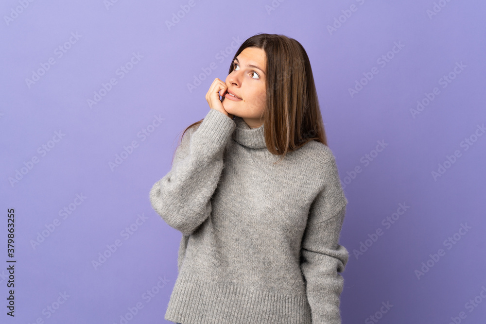 Young Slovak woman isolated on purple background is a little bit nervous Young Slovak woman isolated on purple background is a little bit nervous