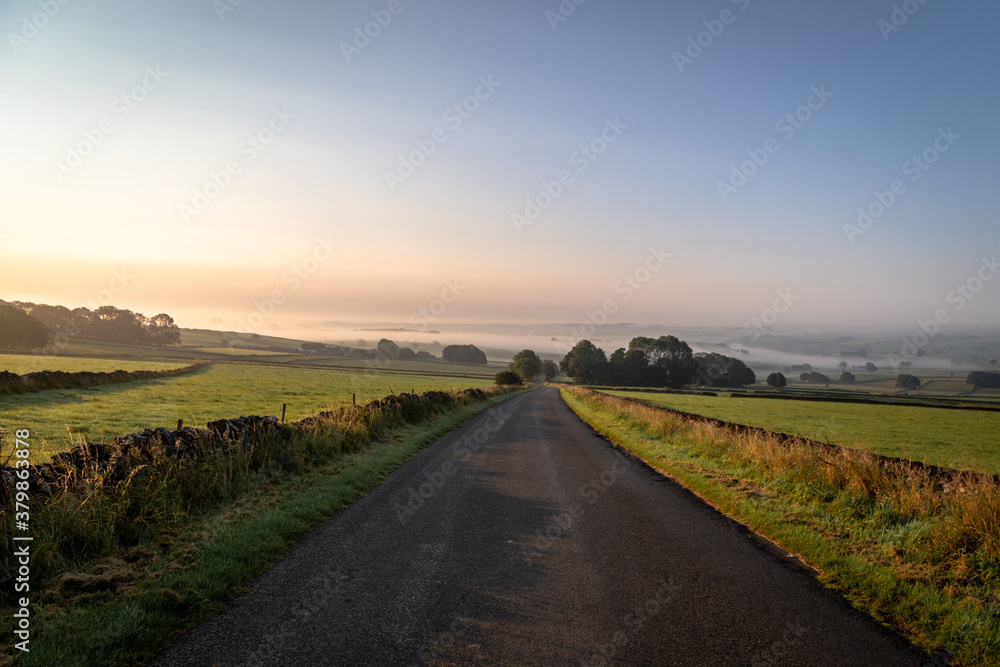 Early morning view up The Jarnett, near Taddington- overlooking a mist covered Flagg & Monyash, Derbyshire