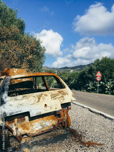 Stolen, burnt out and abandoned car photo