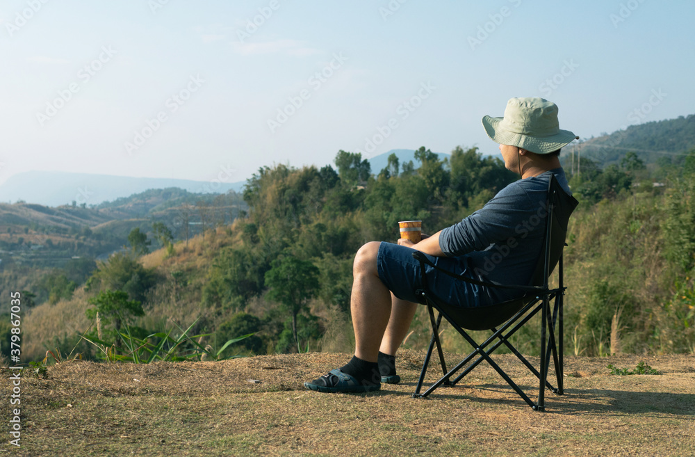 Man traveler photographer and camera taking photo on mountains In the morning the sun rises. Travel Lifestyle hobby concept Man traveler photographer and camera taking photo on mountains In the morning the sun rises. Travel Lifestyle hobby concept