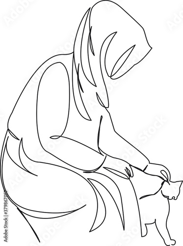 muslim woman petting a cat