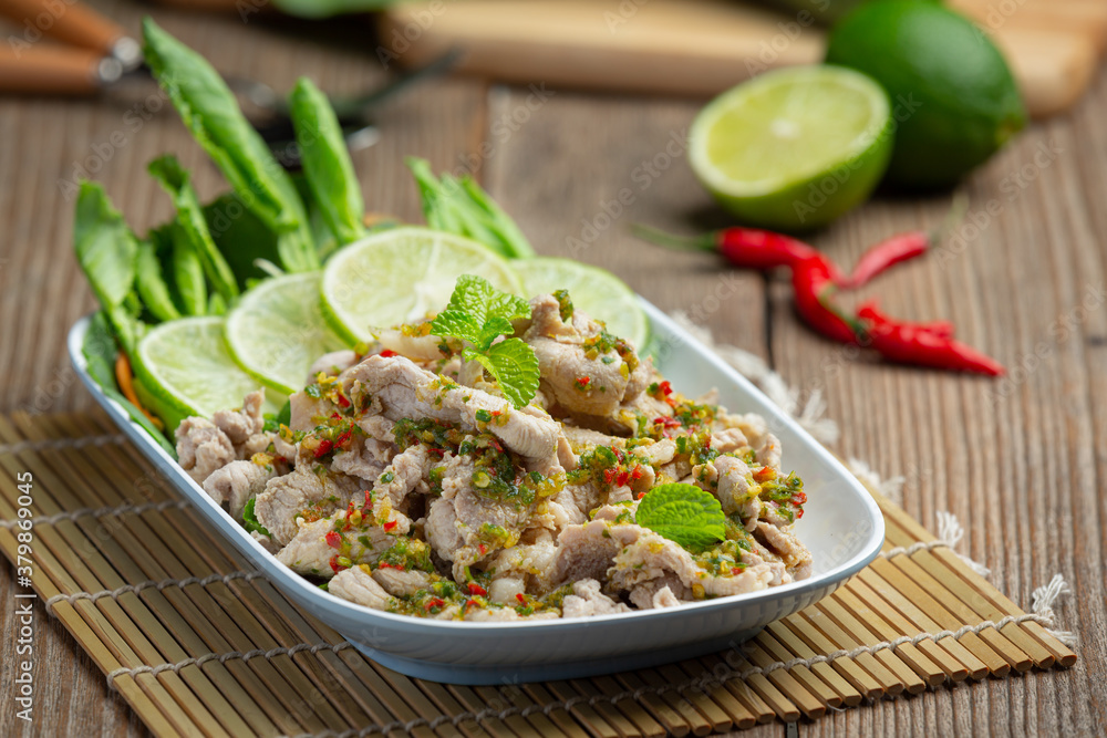 Spicy Pork Salad Served with fresh crispy kale stalks Thai food.