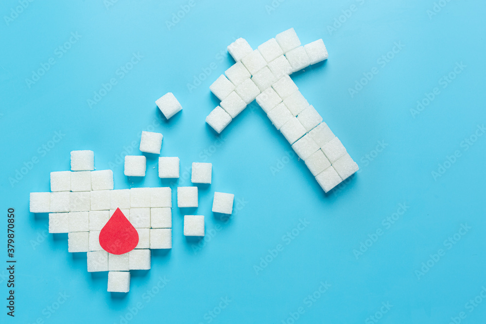 World diabetes day; sugar cubes are arranged in the shape of heart destroyed World diabetes day; sugar cubes are arranged in the shape of heart destroyed