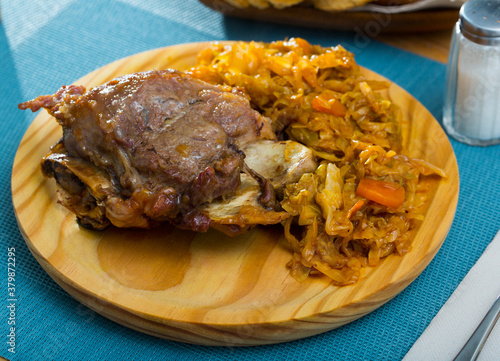 Pork cheeks with braised cabbage, original catalonian dish Galtas al horno photo