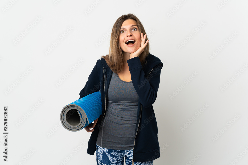 Fototapeta premium Slovak girl going to yoga classes isolated on white background with surprise and shocked facial expression