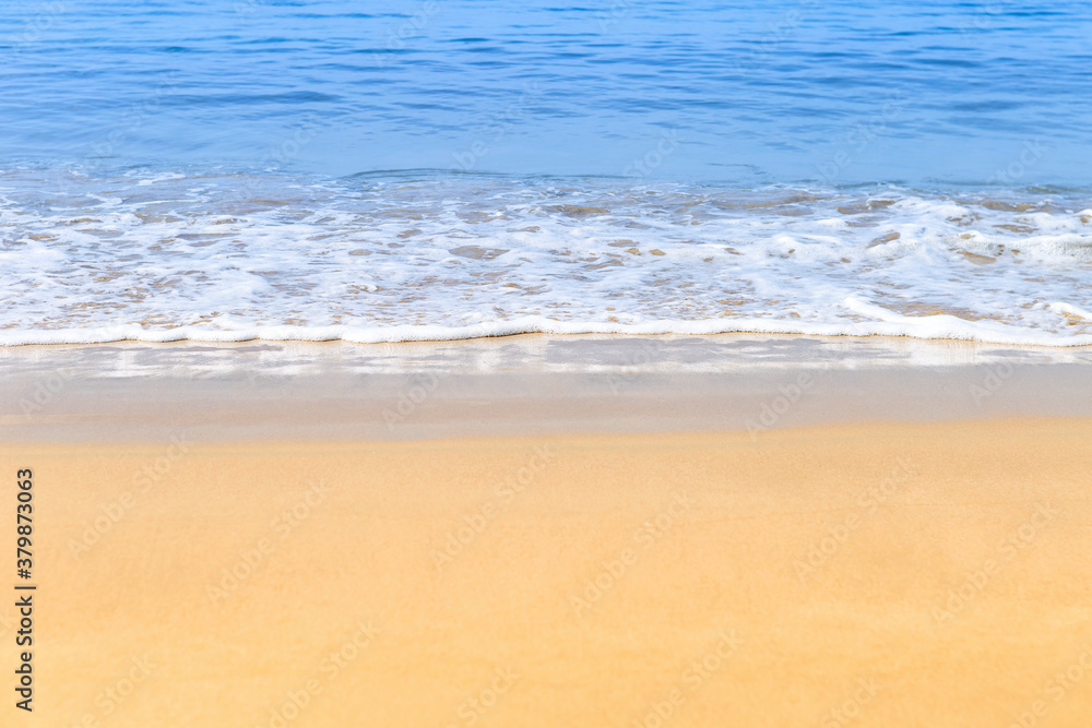 White wave on the clean sand beach with summer outdoor day light, nature and environmental concept background White wave on the clean sand beach with summer outdoor day light, nature and environmental concept background